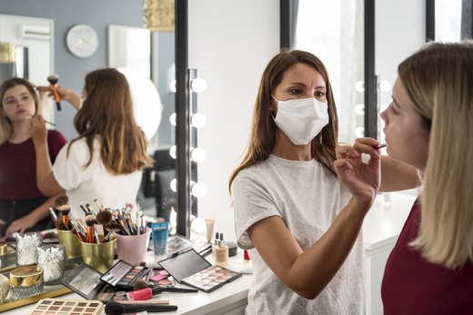 make-up-artist-wearing-medical-mask-reflection-mirror.jpg