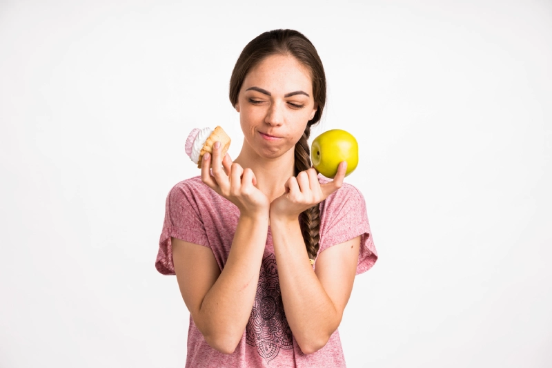 Click to enlarge woman-choosing-cupcake-apple.jpg